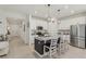 Spacious kitchen with granite countertops, a large island, and stainless steel appliances at 394 Quayside Ave, Mascotte, FL 34753