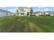 Spacious backyard with green grass and trees, perfect for outdoor activities at 3941 Willowbrook Dr, Edgewater, FL 32141