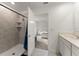 This bathroom features a tiled shower with glass door and a view into the bedroom at 3941 Willowbrook Dr, Edgewater, FL 32141