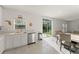 The eat-in kitchen area features sliding glass doors for plenty of light and backyard access at 3941 Willowbrook Dr, Edgewater, FL 32141