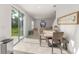 Dining area open to the living room with sliding glass doors to the outdoor space at 3941 Willowbrook Dr, Edgewater, FL 32141