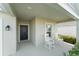 Inviting front porch featuring classic white rocking chairs and a view of the home's facade and entrance at 3941 Willowbrook Dr, Edgewater, FL 32141