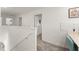 Upstairs hallway leads to bedrooms and features a built-in desk and carpeted floors at 3941 Willowbrook Dr, Edgewater, FL 32141
