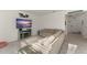 Comfortable living room featuring neutral colors, large TV and sectional sofa at 3941 Willowbrook Dr, Edgewater, FL 32141