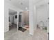 This bathroom includes tiled floors and a walk-in shower, offering a blend of style and convenience at 3977 Willowbrook Dr, Edgewater, FL 32141
