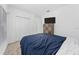 This bedroom has cozy carpet, a queen bed, a closet and a television for relaxing evenings at 3977 Willowbrook Dr, Edgewater, FL 32141