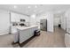 Bright open kitchen features modern stainless steel appliances, light countertops, and hardwood floors at 3977 Willowbrook Dr, Edgewater, FL 32141