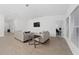 Open living area featuring neutral walls and floors, with comfortable seating, and large windows for natural light at 3977 Willowbrook Dr, Edgewater, FL 32141