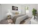 Stylishly decorated bedroom with a large window, comfortable bed, and complementary decor at 404 Famagusta Dr, Davenport, FL 33896