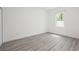 Well-lit bedroom with vinyl flooring, a window, and a closet at 404 Famagusta Dr, Davenport, FL 33896