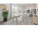 Bright dining room with a view of the kitchen, marble table, and light-colored accents at 404 Famagusta Dr, Davenport, FL 33896