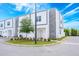 Modern townhouse featuring stone accents, green lawn, and plenty of parking at 404 Famagusta Dr, Davenport, FL 33896