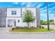 Modern two-story townhome featuring stone accents, well-kept landscaping, and a contemporary design at 404 Famagusta Dr, Davenport, FL 33896