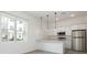 Modern eat-in kitchen featuring stainless steel appliances and quartz countertops at 404 Famagusta Dr, Davenport, FL 33896