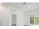 Bright living room featuring wood floors and slider doors leading to the pool at 404 Famagusta Dr, Davenport, FL 33896