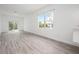 A spacious living room with light-colored walls and sliding glass doors leading to a patio at 404 Famagusta Dr, Davenport, FL 33896