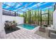 Screened in pool with dining and lounge area offering private relaxation and outdoor enjoyment at 404 Famagusta Dr, Davenport, FL 33896