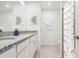 Well-lit bathroom features a double vanity with granite countertops and modern fixtures at 4129 Lavender Ct, Lake Hamilton, FL 33851