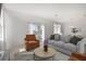 Inviting living room boasts ample seating and natural light, perfect for entertaining or relaxation at 4129 Lavender Ct, Lake Hamilton, FL 33851