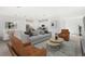 Bright living room featuring lots of seating, open to the kitchen and dining areas at 4129 Lavender Ct, Lake Hamilton, FL 33851