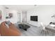 Comfortable living area with plush seating, neutral tones, and space for work and relaxation at 4129 Lavender Ct, Lake Hamilton, FL 33851