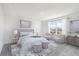 Serene main bedroom retreat with natural light, plush carpeting, and stylish decor at 4129 Lavender Ct, Lake Hamilton, FL 33851