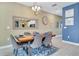 Charming dining room features a wooden table, seating for six, and stylish decor at 424 Ocean Course Ave, Davenport, FL 33896