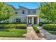 Charming two-story townhouse with well-maintained landscaping and inviting entrance at 424 Ocean Course Ave, Davenport, FL 33896