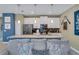 Bright kitchen island with seating overlooks the living area, creating a cozy and inviting atmosphere at 424 Ocean Course Ave, Davenport, FL 33896