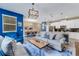 Open-concept living room features a cozy atmosphere with views of the dining and kitchen area at 424 Ocean Course Ave, Davenport, FL 33896