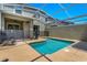 A screened-in pool with chairs and a safety fence with view of the house at 424 Ocean Course Ave, Davenport, FL 33896