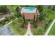 Aerial view of community pool, cabana, playground and landscaping at 4265 Foxhound Dr, Clermont, FL 34711