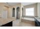 Bright bathroom showcasing a walk-in shower and a soaking tub under a window at 4265 Foxhound Dr, Clermont, FL 34711