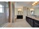 Bright bathroom showcasing a walk-in shower, a soaking tub, and and sinks with granite countertops at 4265 Foxhound Dr, Clermont, FL 34711