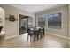 Cozy dining area featuring tile flooring, large windows, and sliding glass doors to outdoor living space at 4265 Foxhound Dr, Clermont, FL 34711
