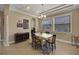 Bright dining room with tile flooring, tray ceiling, and views to the front yard through large windows at 4265 Foxhound Dr, Clermont, FL 34711