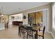 Bright dining area with tile floors, patio access, and seamless flow into living spaces at 4265 Foxhound Dr, Clermont, FL 34711