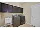 Laundry room with sink, washer and dryer, and plenty of cabinet space at 4265 Foxhound Dr, Clermont, FL 34711