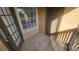 Enclosed balcony features tile flooring, screened windows, and a convenient storage closet at 445 Fountainhead Cir # 262, Kissimmee, FL 34741
