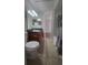 Bathroom with tile flooring, vanity and granite counters plus shower and tub combo at 445 Fountainhead Cir # 262, Kissimmee, FL 34741