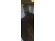 Bedroom with dark wood floors and mirrored closet doors at 445 Fountainhead Cir # 262, Kissimmee, FL 34741