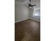 A bedroom with a ceiling fan, wood floors, and a window nook with a cushioned seat at 445 Fountainhead Cir # 262, Kissimmee, FL 34741