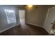 Bedroom featuring wood floors, a ceiling fan, and a bright window at 445 Fountainhead Cir # 262, Kissimmee, FL 34741