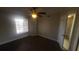 Bedroom with wood floors, ceiling fan, and a window at 445 Fountainhead Cir # 262, Kissimmee, FL 34741