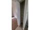 Linen closet with shelving for storage, next to modern wood flooring at 445 Fountainhead Cir # 262, Kissimmee, FL 34741