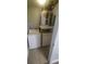 Practical laundry room with washer, dryer, and water heater on a shelf at 445 Fountainhead Cir # 262, Kissimmee, FL 34741