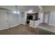 Open concept living area featuring a kitchen and wood-look flooring at 445 Fountainhead Cir # 262, Kissimmee, FL 34741