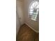 Staircase landing features wood-look flooring and natural light at 445 Fountainhead Cir # 262, Kissimmee, FL 34741