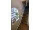 Staircase with wood-look flooring and natural light at 445 Fountainhead Cir # 262, Kissimmee, FL 34741