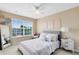 Cozy bedroom featuring a plush bed, decorative pillows, and window views at 449 Cruz Bay Cir, Winter Springs, FL 32708